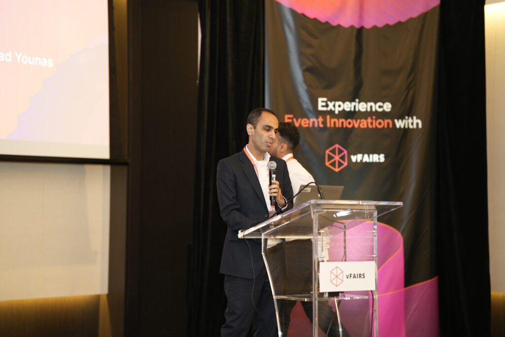 A depiction of how a conference is like with speakers presenting during their designated sessions. This exemplifies the format